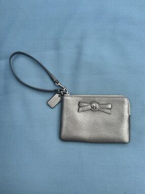 Coach Metallic Silver Wristlet with Bow Accent